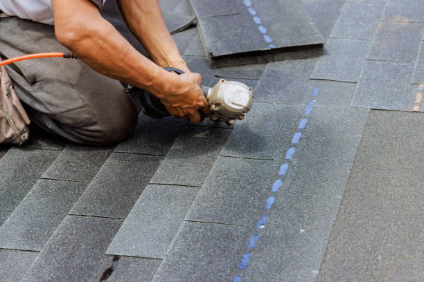 istock New asphalt bitumen shingles are being installed by roofer using a pneumatic air nail gun 2150714734