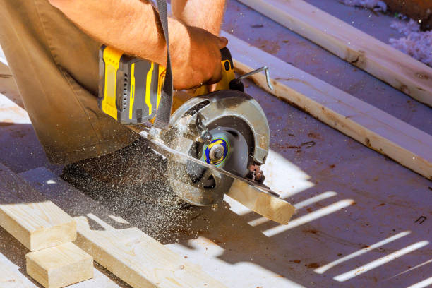 istock Processing of woodworking carpenter cutting wooden beam using a handsaw 2150714755