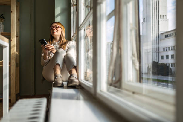 istock Businesswoman Managing Tasks on Phone in Office 2150716235