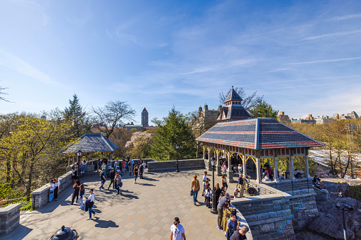 New York. USA. 04.14.2024. Beautiful view of Belvedere Castle in Central Park, New York City, where people admire the landmarks on a sunny spring day.