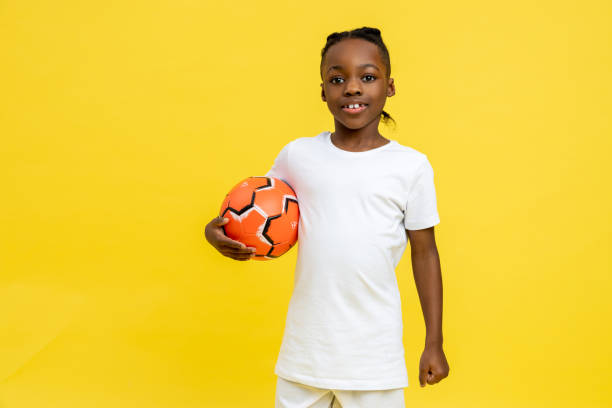 istock Mixed-race little boy having football workout with ball 2150717420