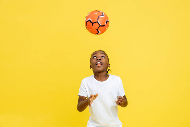 istock Young multicultural boy in sportswear playing with soccer ball 2150717436