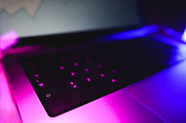 istock close up of computer keyboard at night. 2150717446