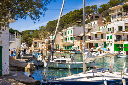 Cala Figuera, Spain -April 20, 2024: Boats docked in the picturesque harbor of Cala Figuera, within a scenic little bay. Known for its beauty, this harbor in southeastern Mallorca attracts a plethora of tourists each year.