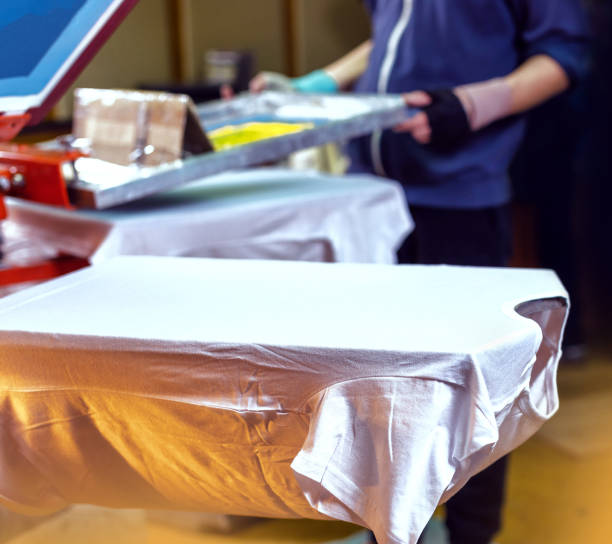 istock manual screen printing. silkscreen printing production. silk screen textile printery 2150723221
