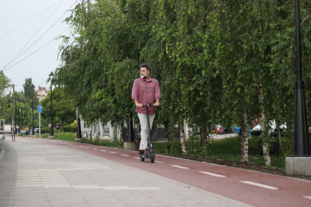 istock Mature man dog and scooter 2150723260