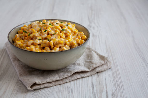 istock Homemade Slow Cooker Creamed Corn in a Bowl, side view. Copy space. 2150723420