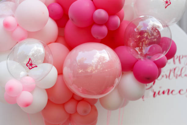 istock Birthday decorations with pink balloons and a bunny figurine 2150724575