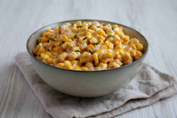 istock Homemade Slow Cooker Creamed Corn in a Bowl, low angle view. Close-up. 2150724765