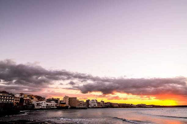 Sea and Building at Sunset in El Medano Tenerife Canary Islands