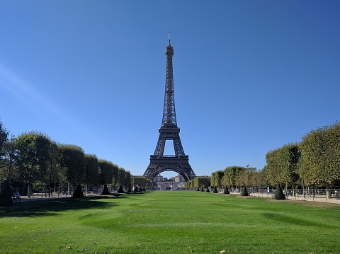 The Eiffel Tower in Paris, France against a blue sky