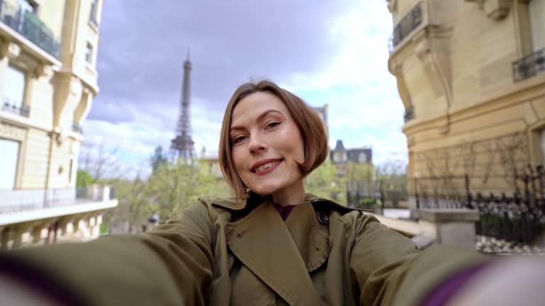 Young Woman Taking Selfies With The View Of Eiffel Tower In Paris, France