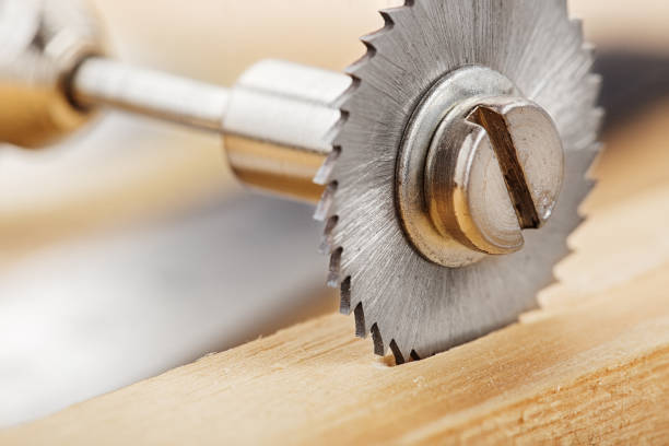 circular saw for milling machine cutting hole in wooden plank.