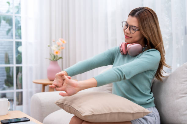 istock Relaxed Woman Stretching at Home 2150731267
