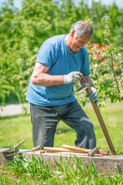 istock An elderly man is fixing his gardening tool 2150731536