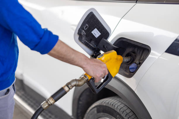 istock Man refueling a tank at a gas station 2150732240