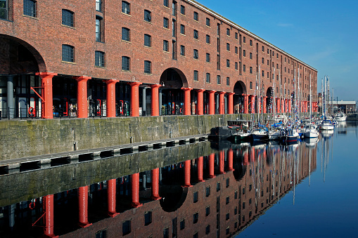 View across the Albert Dock in the centre of Liverpool, UK  Boats can be seen in the dock.  There are no people in the photograph.