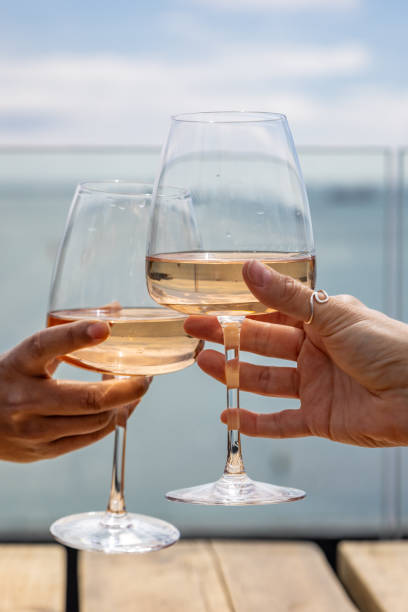 istock A celebratory toast at the coast, with a shallow depth of field 2150737019