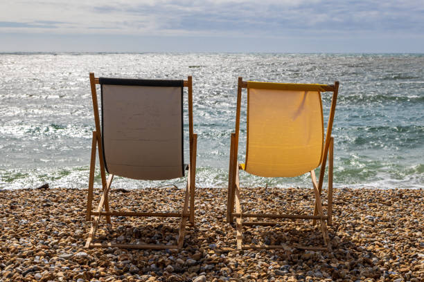 blue and red striped deck chairs ona sunny day on an english beach