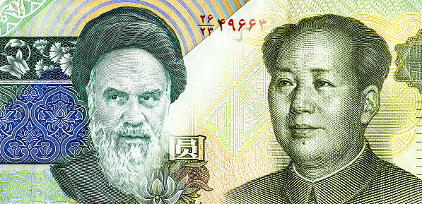 Portrait of Ayatollah Ruhollah Khomeini against Mao Zedong. Iranian rial and Chinese yuan. Business concept of the exchange rate, stock exchange, trading