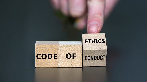 Cubes form the expression 'code of conduct' and 'code of ethics'.