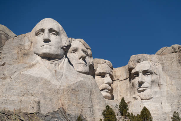 Mount Rushmore on a blue sky spring day in South Dakota Mount Rushmore, one of America's greatest attracions located in the Black Hills of South Dakota theodore roosevelt us president stock pictures, royalty-free photos & images