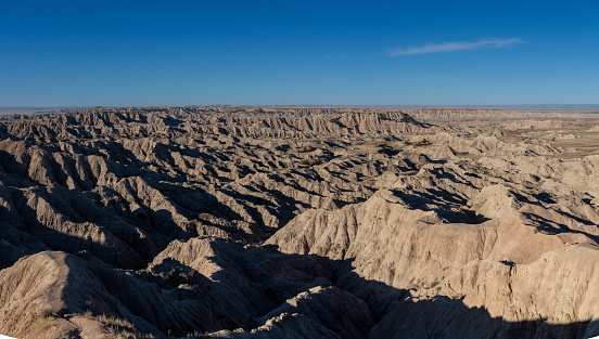The rugged beauty of the Badlands draws visitors from around the world. These striking geologic deposits contain one of the world’s richest fossil beds. Ancient horses and rhinos once roamed here. The park’s 244,000 acres protect an expanse of mixed-grass prairie where bison, bighorn sheep, prairie dogs, and black-footed ferrets live today.