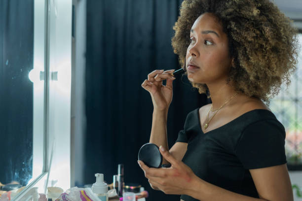 istock Professional makeup artist serves her client inside her beauty salon 2150739579