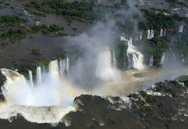 The aerial view of the part of Iguazu Falls with largest waterfalls and a rainbow (Brazil).
