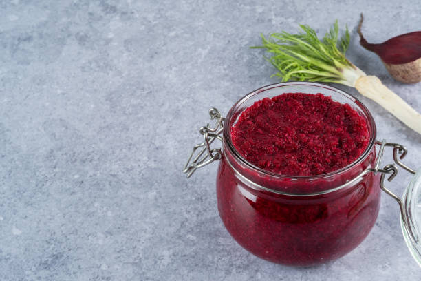 Beet horseradish sauce Creamy horseradish sauce with beets in jar on a gray background. Appetizer, condiment or topping. Healthy vegan food. space for text kosher starter recipes stock pictures, royalty-free photos & images
