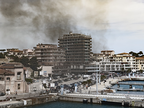 Portoferraio, Italy - April 28, 2024: the port of this town on the Elba island sees plenty of ferry traffic that pollute the air with thick gray clouds of smog