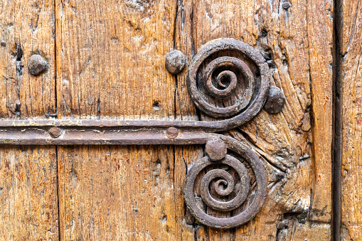 wooden door with old decorative metal elements