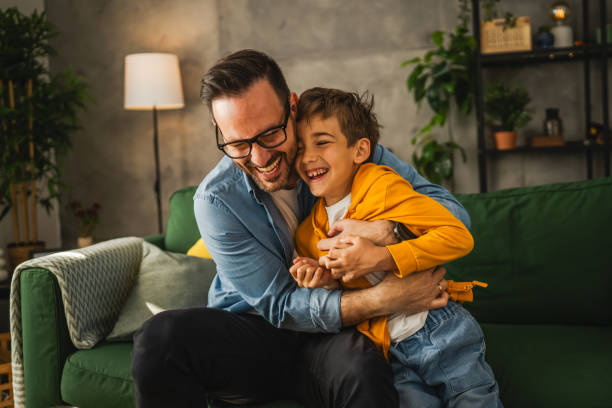 istock Dad and son tickle and have fun at home 2150745047