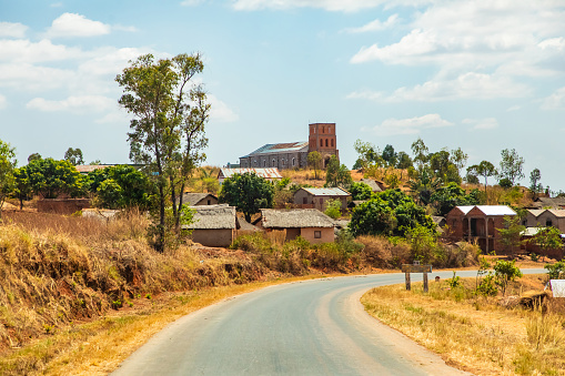 Antsirabe area, Madagascar. 20 october 2023. Madagascar roads. path from Antsirabe through small villages, houses along road, livestock, rice fields, daily life Malagasy