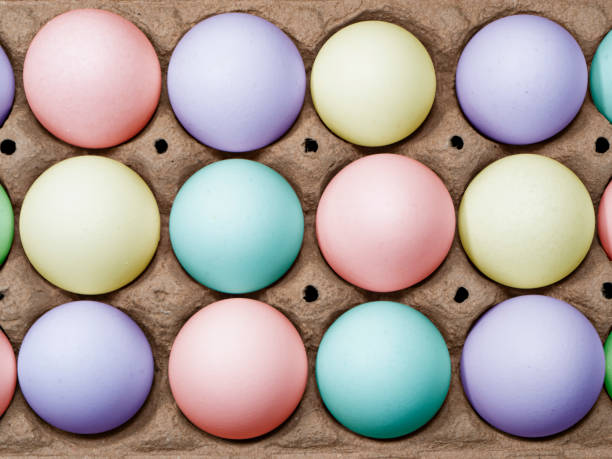 istock Flat lay Close-up view of variable colored chicken eggs in egg paper box. 2150746489