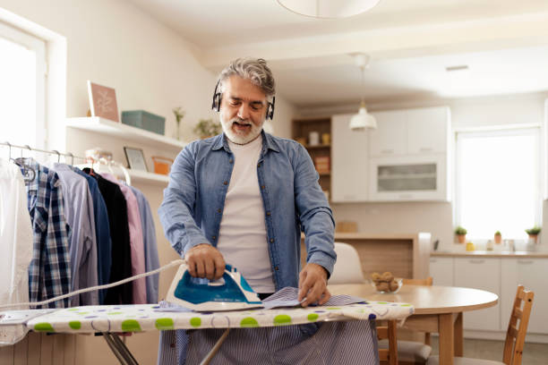 istock Man Ironing Shirt at Home 2150746601