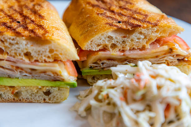 White bread with beechwood smoked bacon, egg, mayonnaise, and tomato served with Caesar pasta with parmesan cheese, morning meal