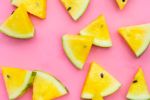 istock Yellow watermelon slices on pink background. 2150750062