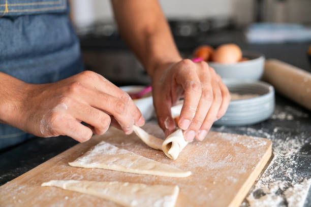 istock Man baking pastries at home 2150750447