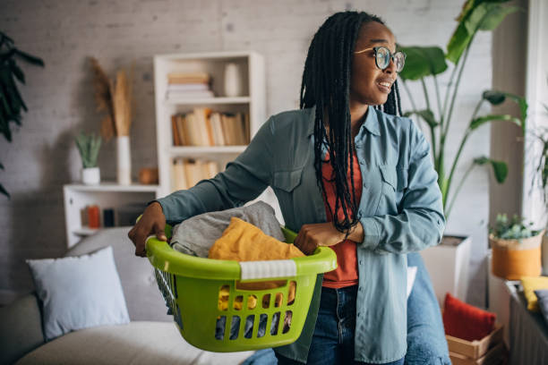 istock Carrying a laundry basket across the living room 2150751204