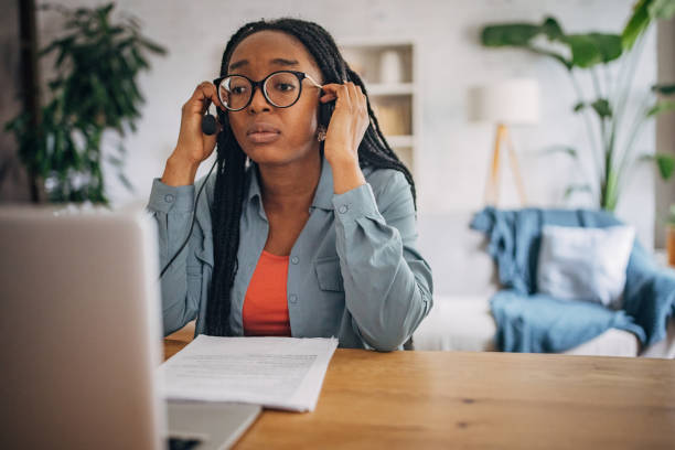 istock Woman adjusting glasses working on laptop 2150751256