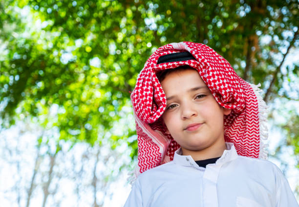 Muslim arabic standing in the park with expression on his face