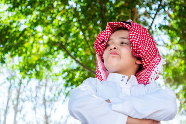 Muslim arabic standing in the park with expression on his face