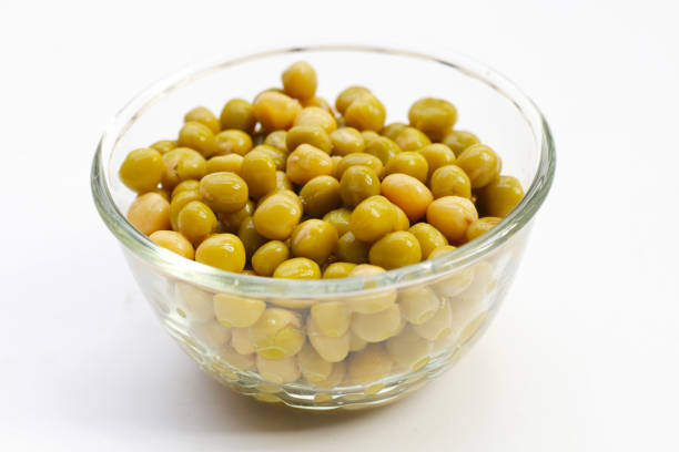 Canned green peas on white background.