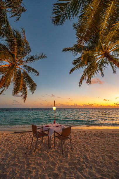 istock Romantic sunset dinner on the tropical paradise beach 2150757095