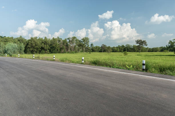 istock Side view of asphalt road with the meadow 2150763464