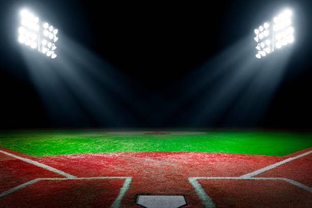 istock Baseball field at night with bright floodlights 2150763607
