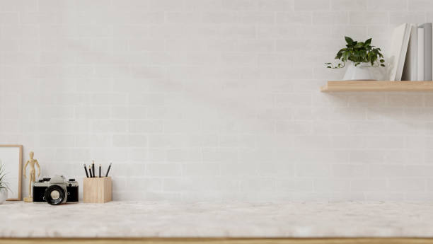 istock A display space on a white marble table showcases products against the white brick wall. 2150765204