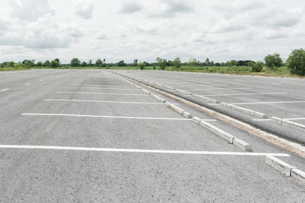 istock Empty parking lot against mountains and beautiful blue sky. 2150766532