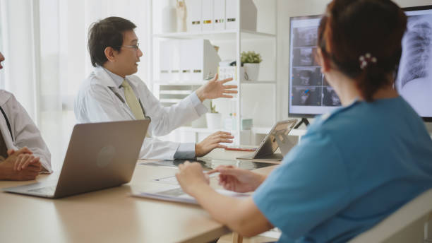istock Doctor Leading Discussion on Patient X-ray Findings. 2150771599